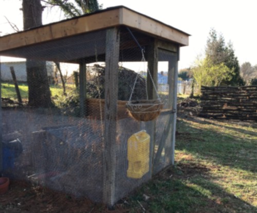 partially constructed outdoor aviary